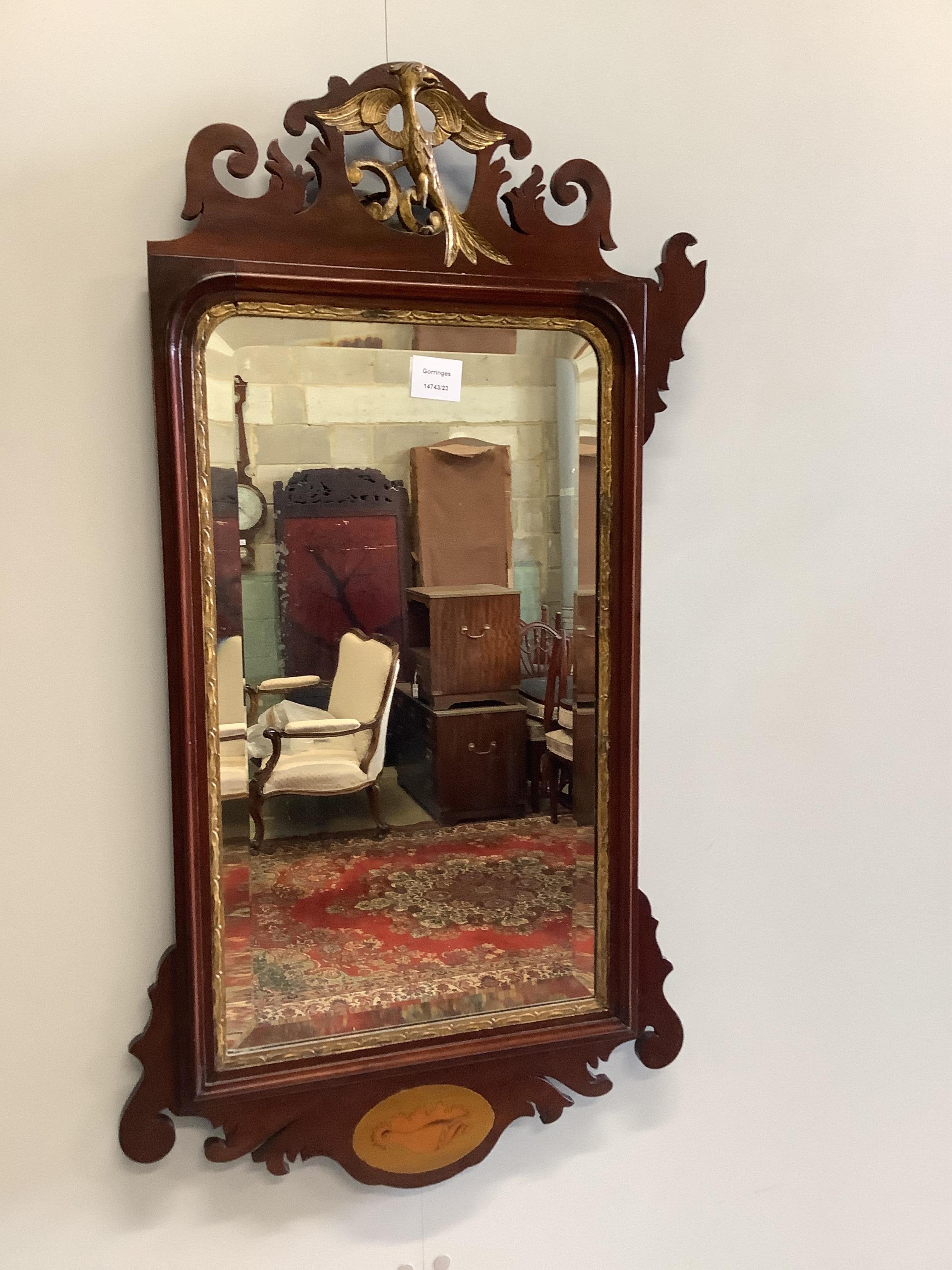 An Edwardian inlaid mahogany fret cut wall mirror, width 50cm, height 91cm. Condition - poor